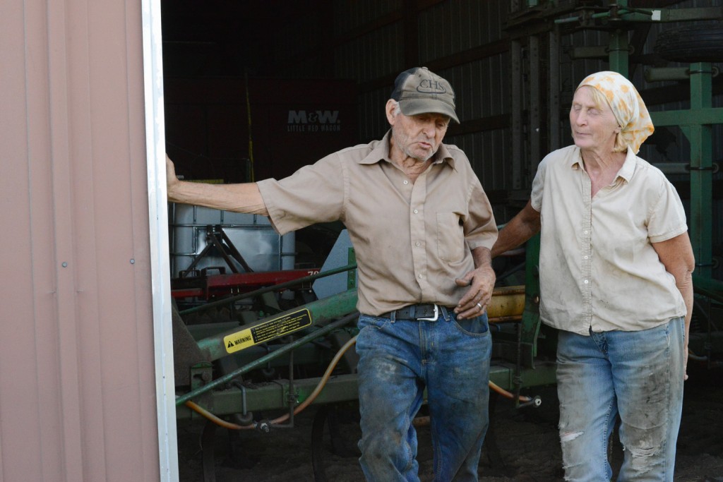 Farmers giving students a tour of the farm they've operated without assistance for decades.